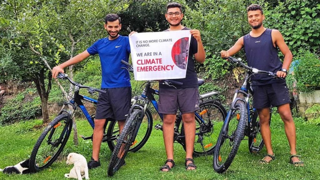 Picture taken before starting the trip, standing with our cycles and banner saying Need to Declare a Climate Emergency in India.