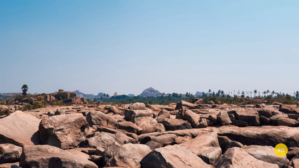 Virupaksha temple visible from Hampi Waterfalls