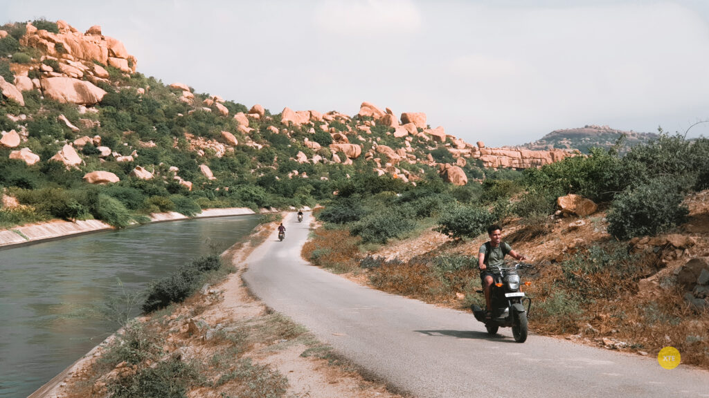 riding a scooter at the Sanapar lake near Hampi Hippie Island