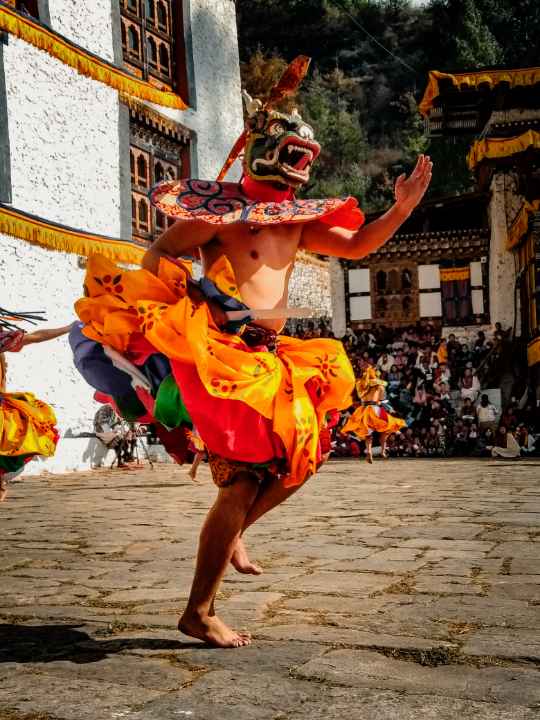 Cham dance perfomances of the best to do list when in Bhutan - Don't miss this unique thing which makes Bhutan the best travel destination
