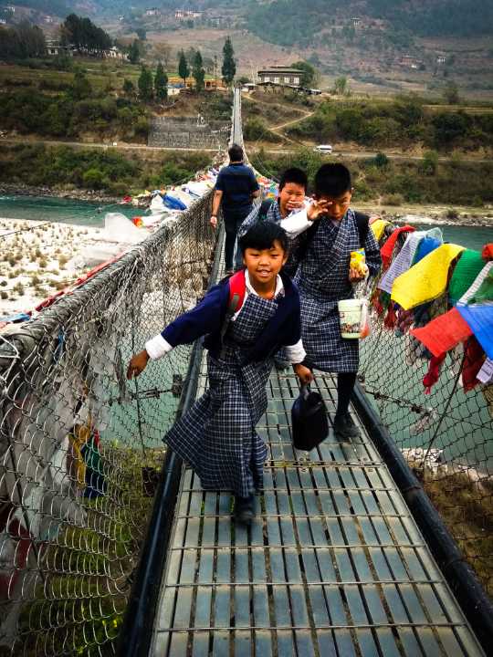 Bhutanese school kids in their traditional attire, showing culture and unique which is unique to any travel destinations