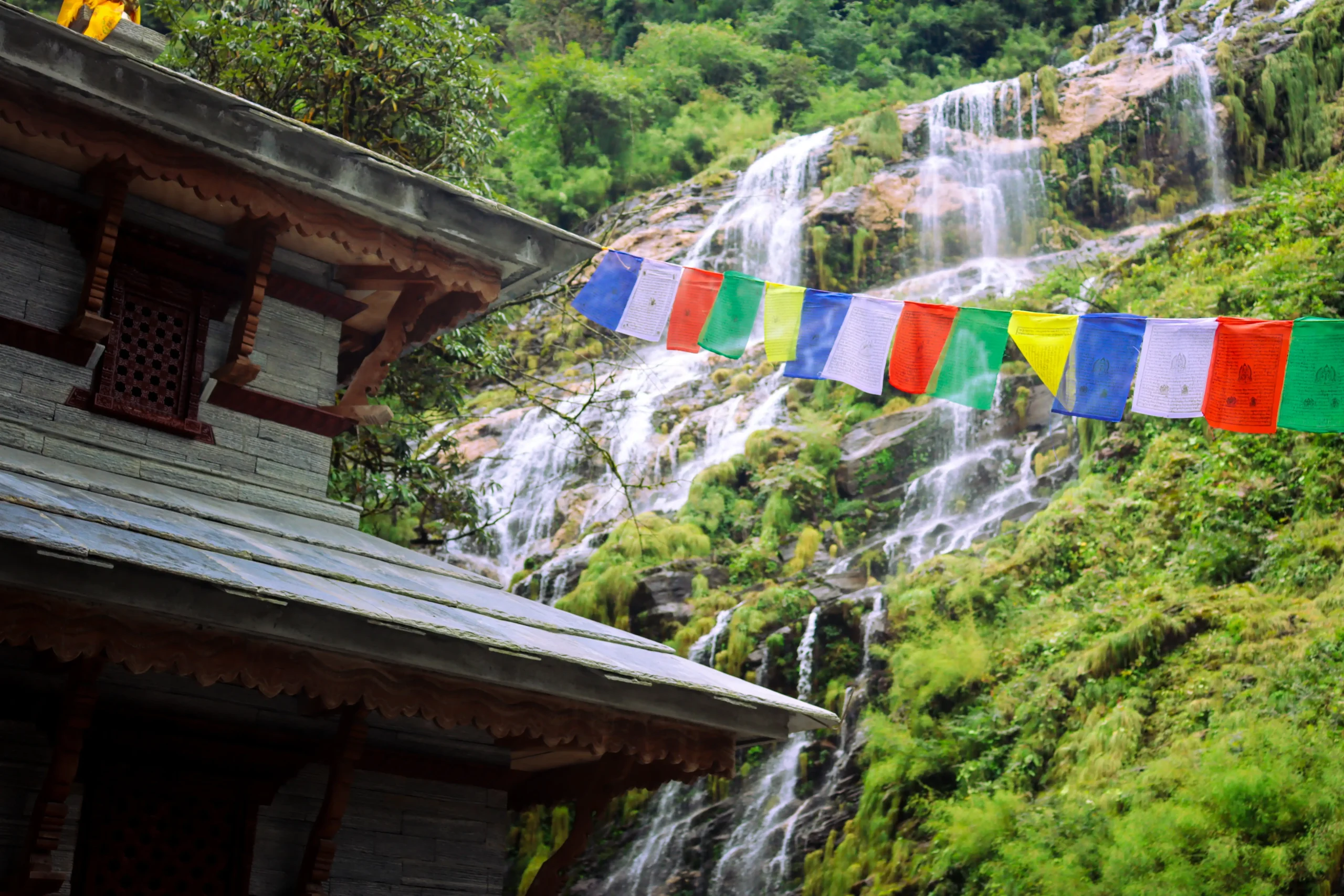Annapurna Base Camp Trek (ABC) – (Xplore The Earth): Waterfall and Tibetan flags