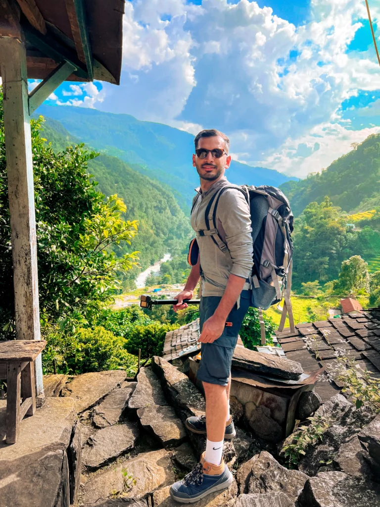 Annapurna Base Camp Trek (ABC) – (Xplore The Earth): Person standing in a lush green valley