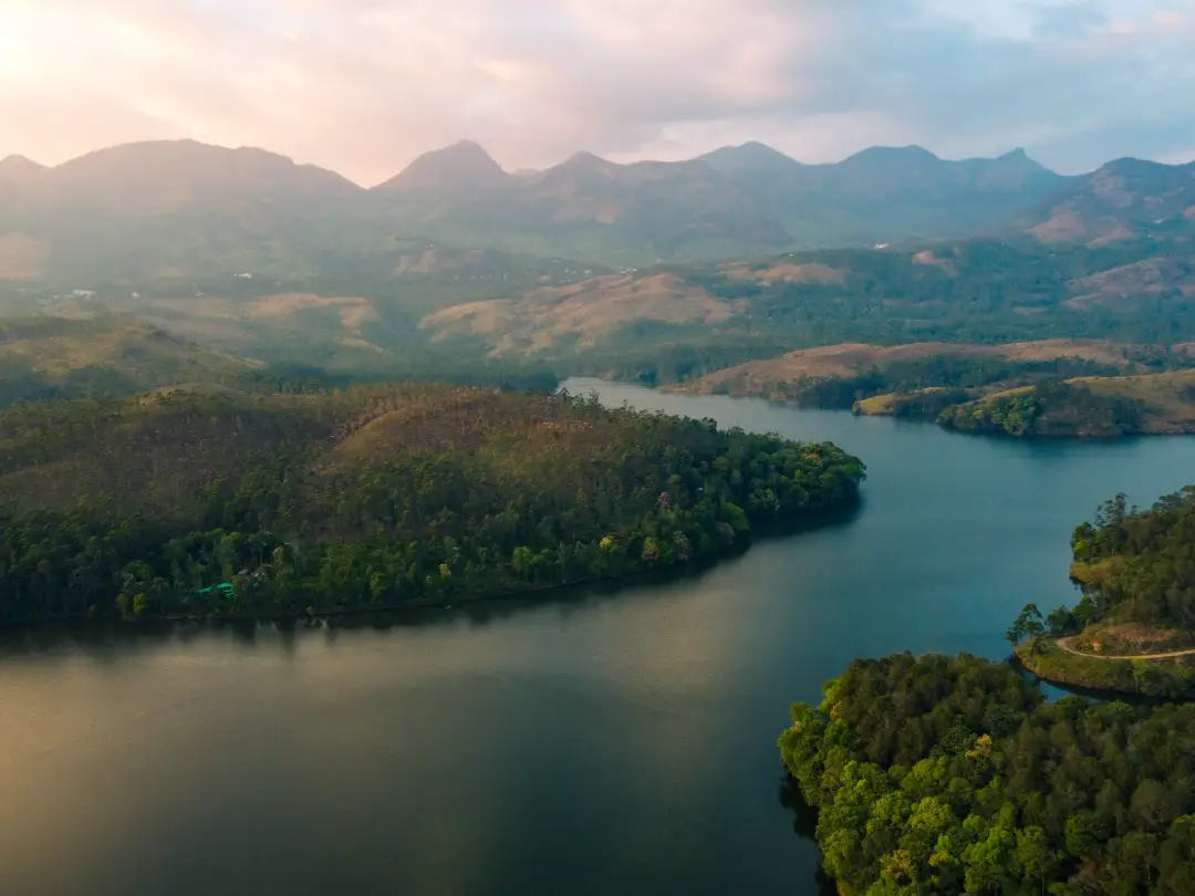 a dam at the foothills of hills in munnar