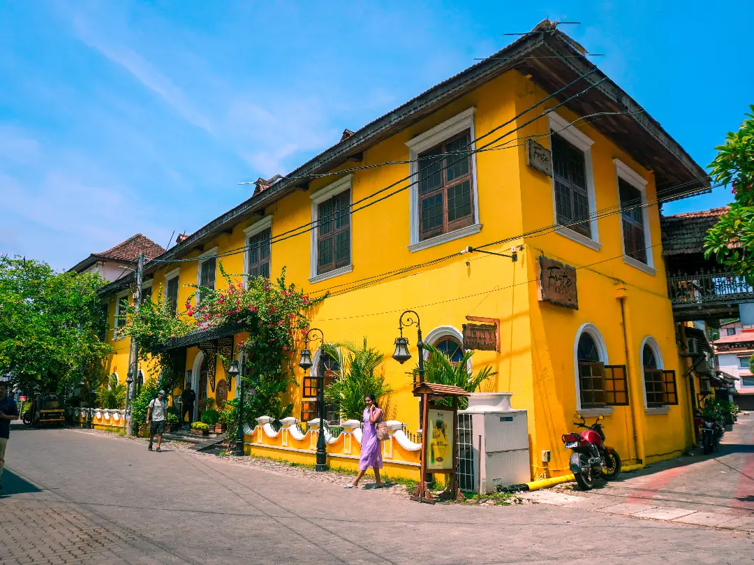 a yellow heritage hotel on princess street of kochi kerala